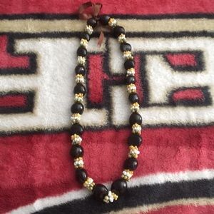 Kukui nut necklace with different colored shells